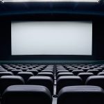 Empty cinema auditorium with chairs.