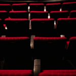 Rows of red seats in a theater