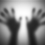 Hands silhouettes touching blurry glass screaming for help