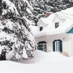 Big house covered with white snow during winter