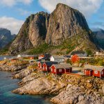 View of the red cottages by the coastline in Hamnøy, Lofoten Islands, Norway